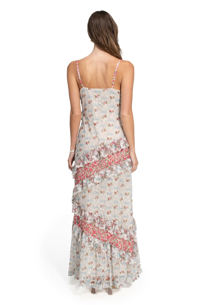 Alana maxi dress with delicate pattern detail print, back view showing adjustable straps and tiered ruffle detailing in coral and cream tones