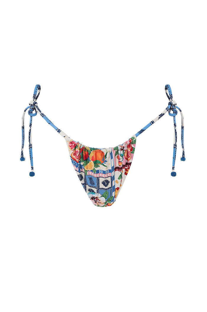 Tie-side bikini bottom with multicolor pattern detail print on front and blue geometric tile pattern on ties with handmade beaded ends