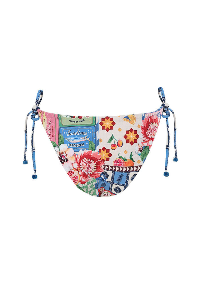 Tie-side bikini bottom with multicolor retro-inspired print featuring florals, fruit, geometric patterns, and sardine tin graphics