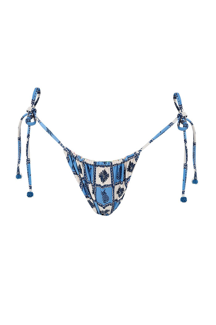 Tie-side bikini bottom in blue and white with checkered pattern featuring pineapple and palm leaf print, adjustable straps with handmade beaded tie e…