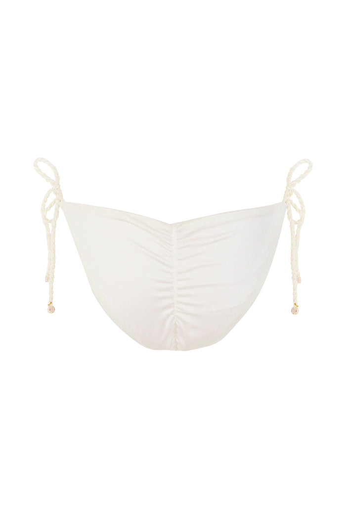Alegria bikini bottom in white with braided side ties and gold-tone beaded tie-ends