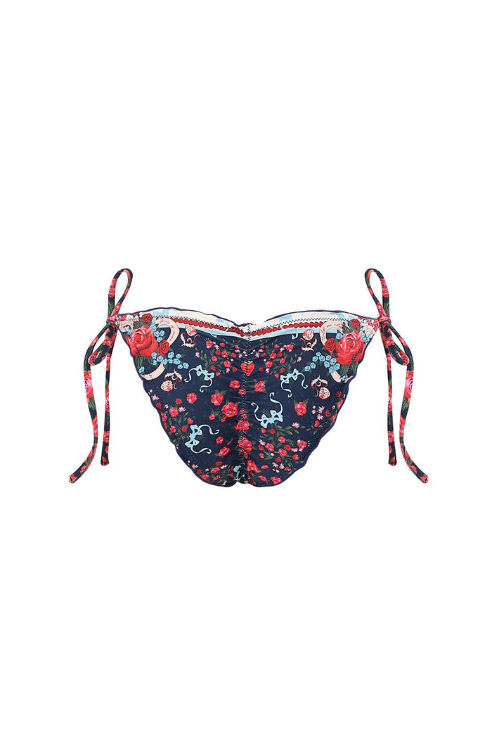 Navy bikini bottom with pattern detail print and coral embroidered trim, featuring adjustable tie sides