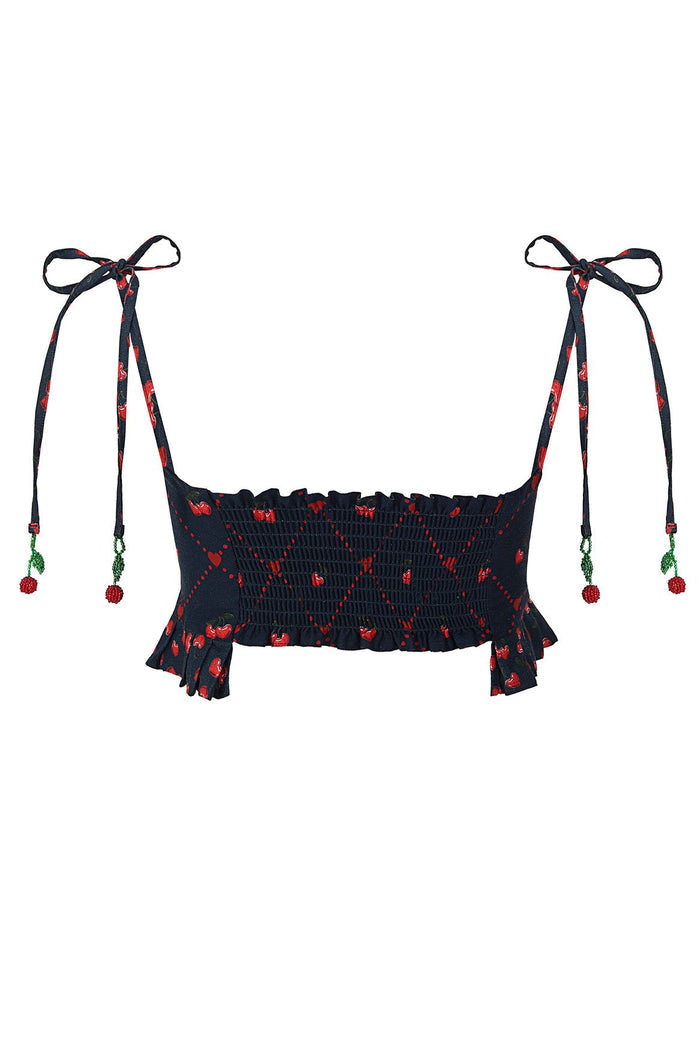 Navy crop top with red cherry print, smocked back, ruffle hem, and adjustable shoulder ties with beaded cherry appliqués