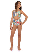 Girls one-piece swimsuit with front cutout, multicolor patchwork print featuring pattern detail panels, checkered sections, and fruit illustrations