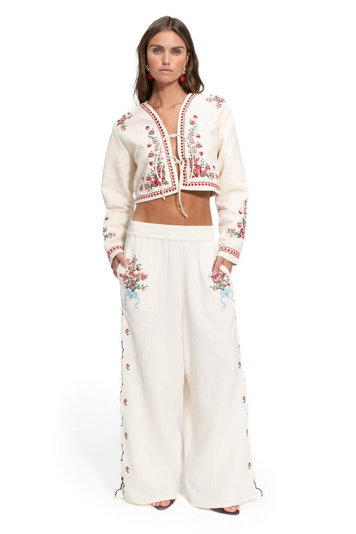 Analissa Jacket in ivory with red and green floral embroidery, cropped length with tie-bow front closure
