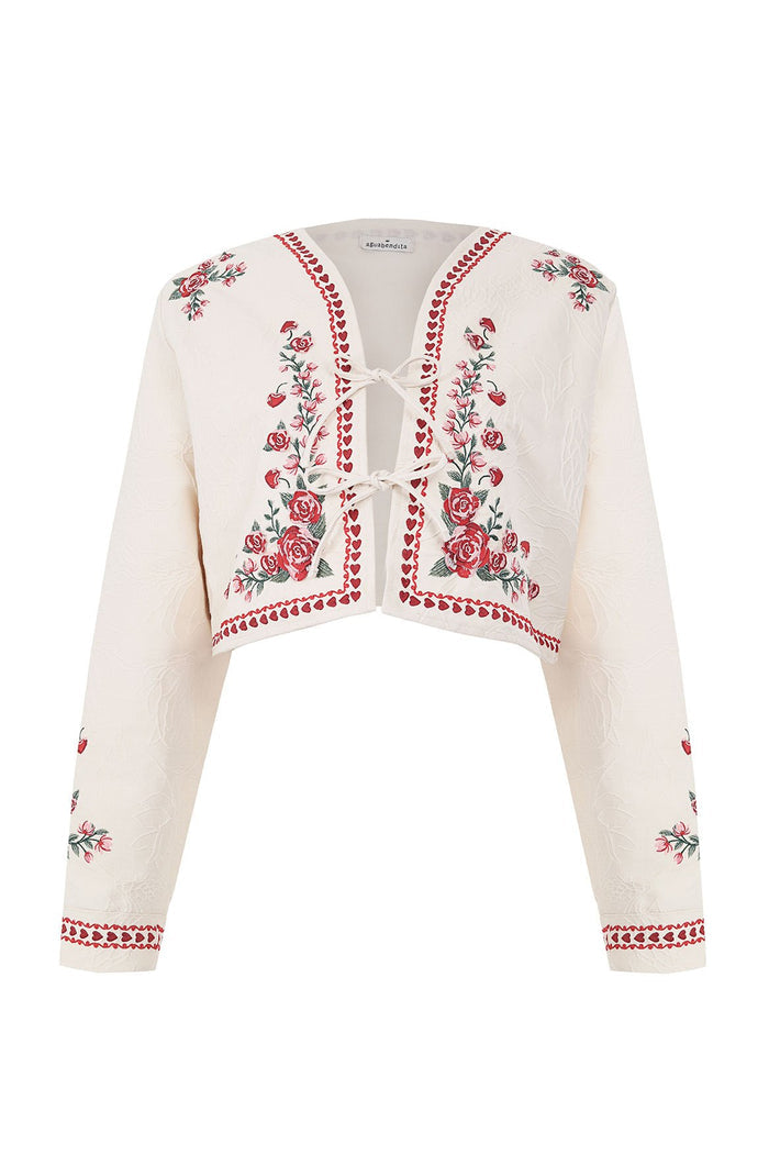 Cream cropped jacket with red and pink floral embroidery, scalloped trim details, and tie-bow front closure