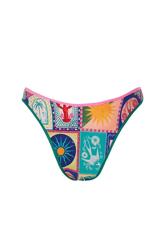 Avy bikini bottom with multicolor patchwork print featuring palm trees, sun bursts, and pattern detail panels with pink waistband and teal trim