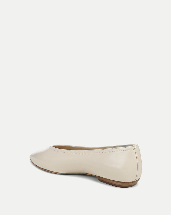Veronica Beard Cream patent leather ballet flat with a low heel.