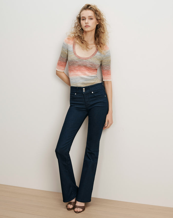 Veronica Beard Striped knit top and dark wash flare jeans.