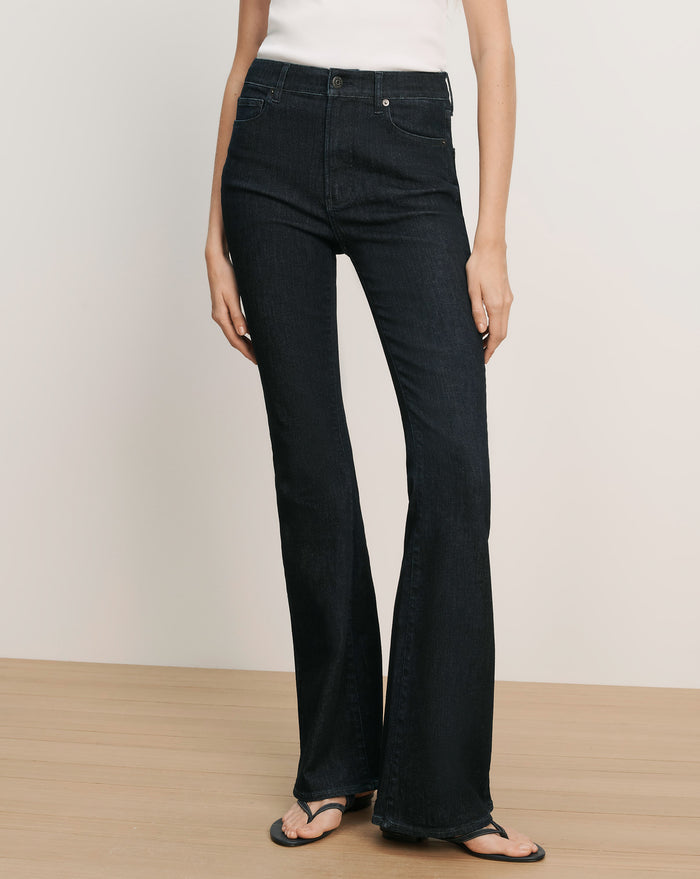 Veronica Beard Dark wash denim flare jeans with a high waist and subtle whiskering.