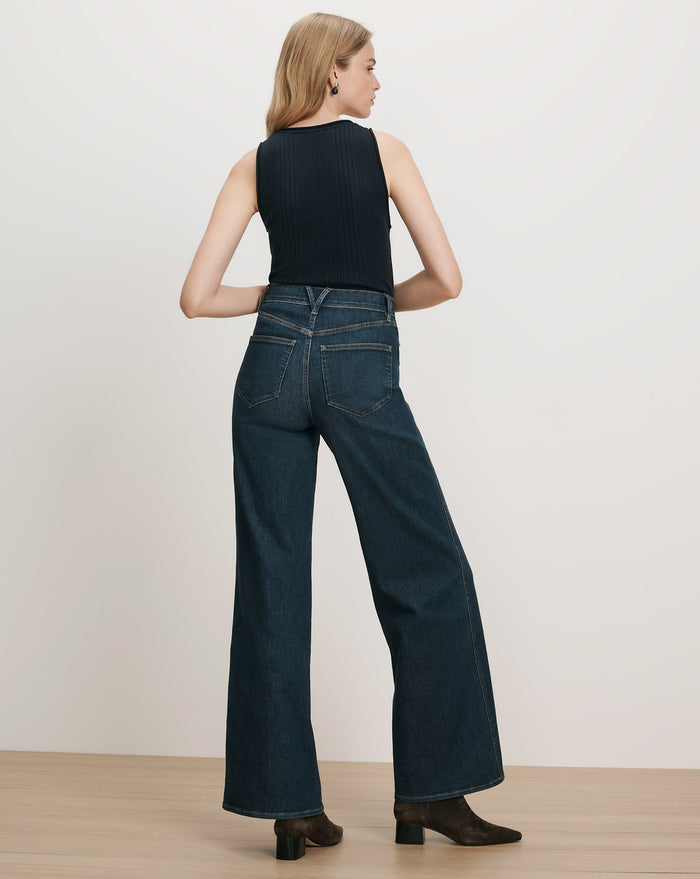 Veronica Beard Dark wash wide-leg jeans and black ribbed tank top.