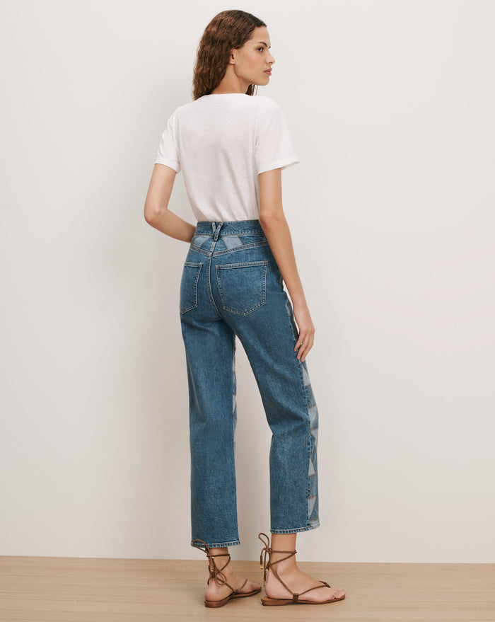 Veronica Beard Blue denim jeans with geometric side panel details.