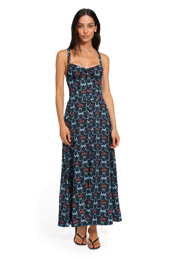 Navy maxi dress with sweetheart neckline and all-over print of turquoise curved shapes and coral dotted clusters