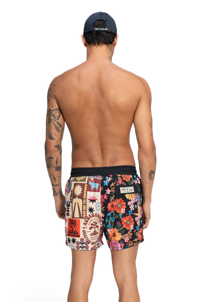 Men's swim trunks with mixed placement print combining vibrant floral pattern and graphic panel with geometric shapes and text elements