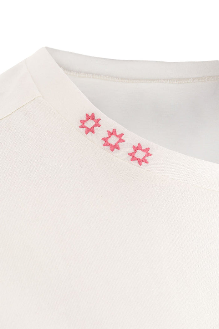 White cotton T-shirt with three coral embroidered star details along the neckline
