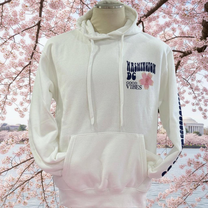 White hoodie with text and design on a mannequin against a white background
