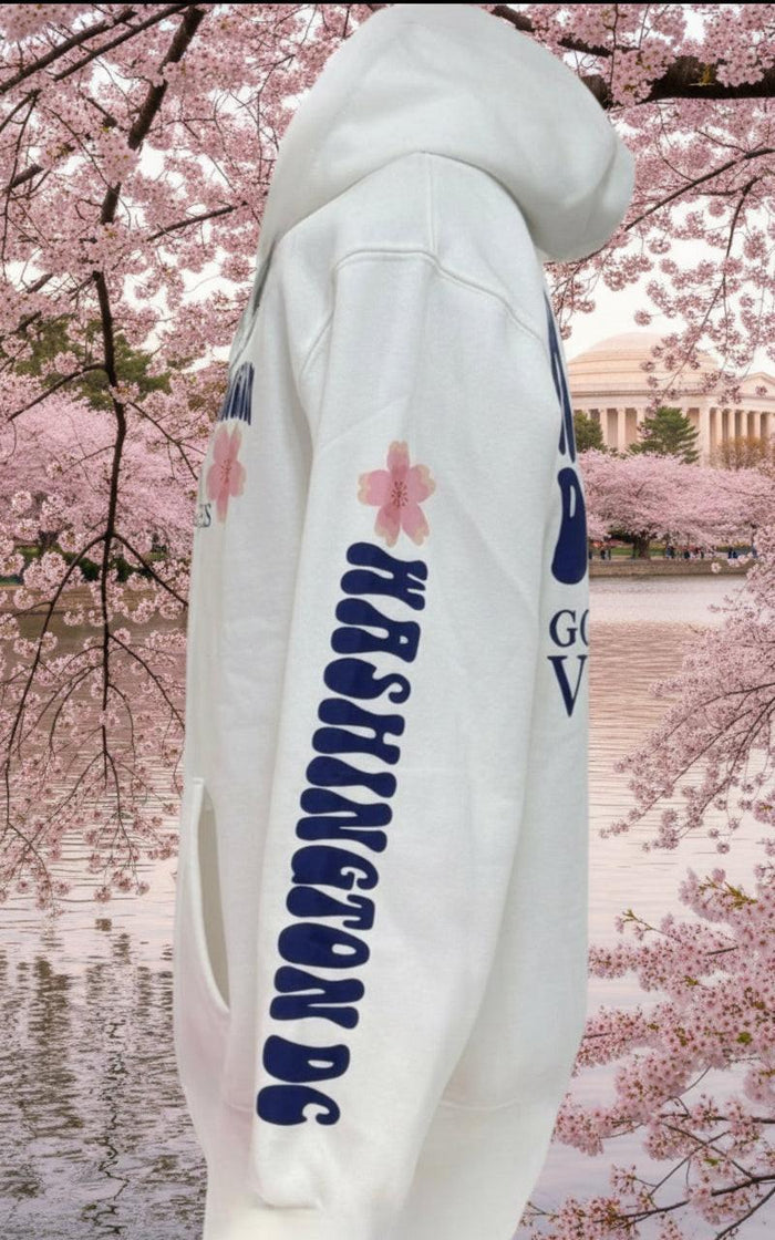 side view of whitehoodie with floral designs and text on a white background