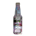 A novelty bottle-shaped bottle opener featuring a printed collage of the Washington Monument, Capitol building, cherry blossoms, and the text 'Washington DC', set against a plain white background.