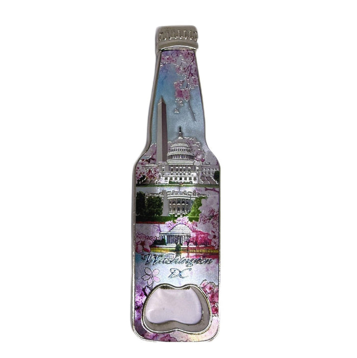 A novelty bottle-shaped bottle opener featuring a printed collage of the Washington Monument, Capitol building, cherry blossoms, and the text 'Washington DC', set against a plain white background.