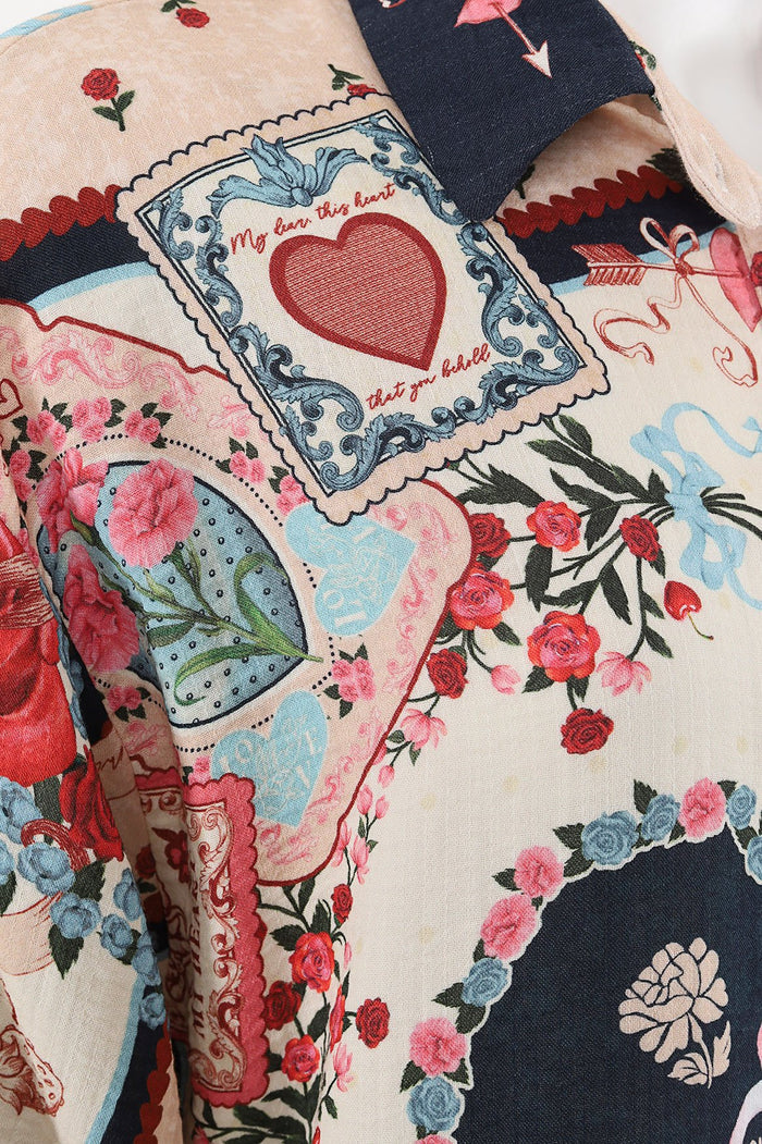 Chrissy shirt in multicolor patchwork print with embroidered heart emblems, roses, arrows, and contrasting navy and cream panels