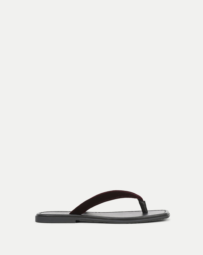 Veronica Beard Black leather sandal with a dark red velvet strap.