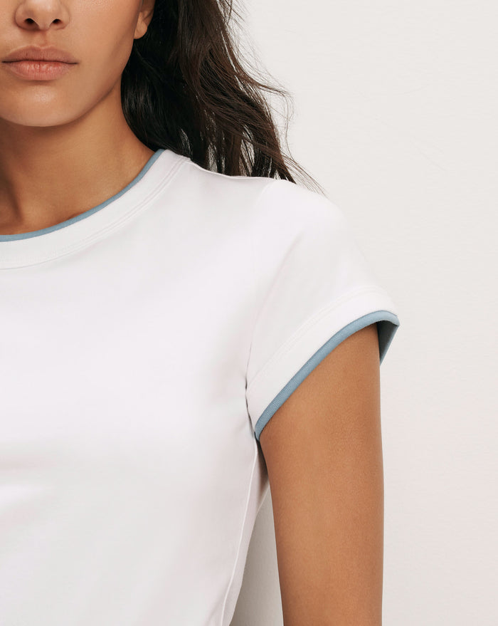 Veronica Beard White t-shirt with blue trim.