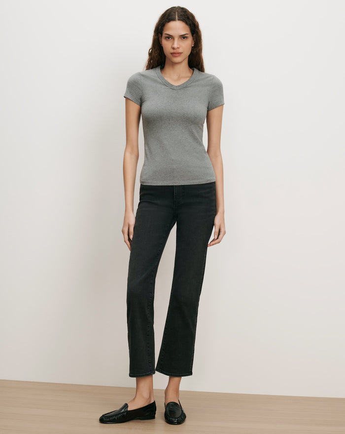 Veronica Beard Gray V-neck t-shirt, black jeans, black loafers.
