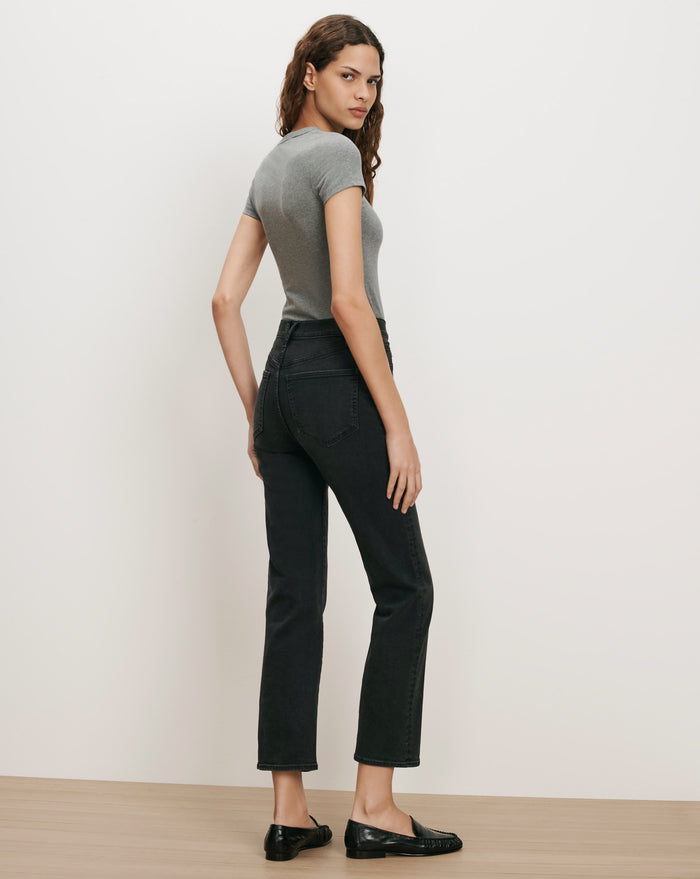 Veronica Beard Gray t-shirt, black jeans, black loafers.