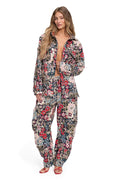 Ethan shirt in jacquard fabric with allover floral pattern in red, pink, blue, and green tones, long sleeves, button-up front, and relaxed fit