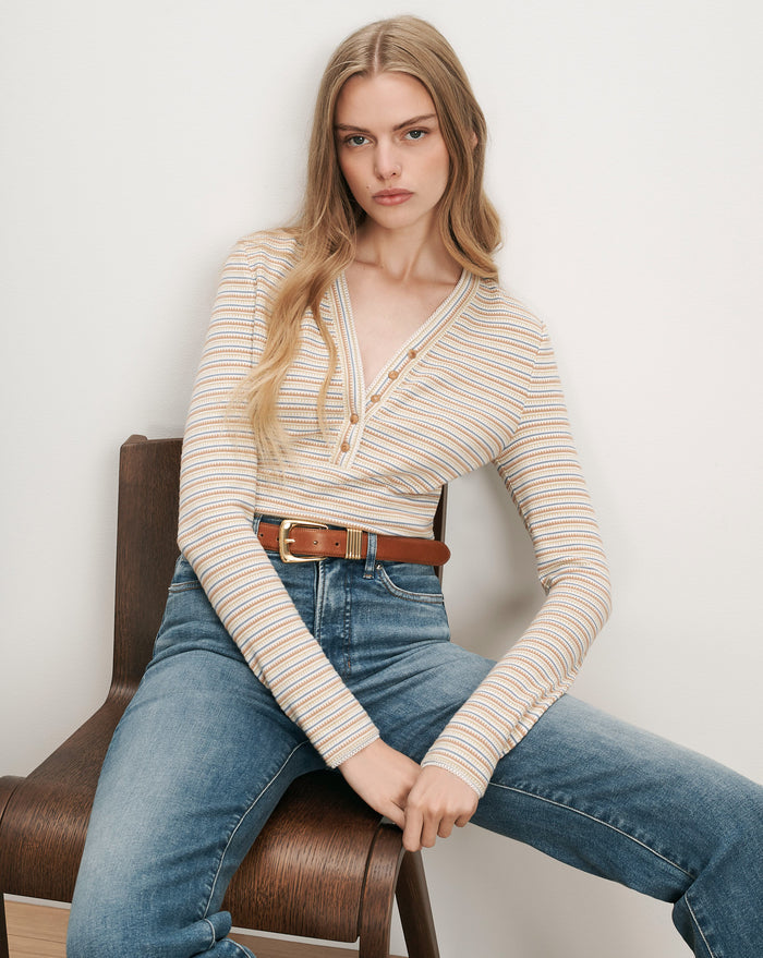 Veronica Beard Striped knit top with buttons and jeans.