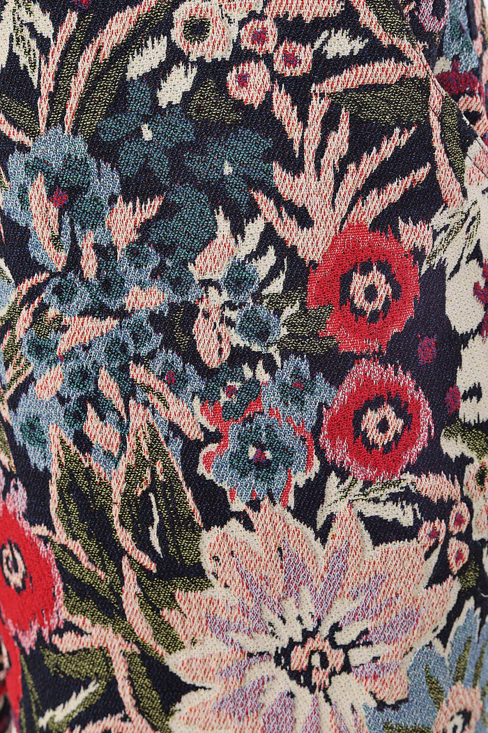 Fallon Pants in textured jacquard with floral pattern in coral, pink, blue, and cream on navy background