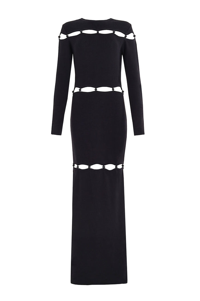 Black long-sleeve maxi dress with oval cut-out panels at chest, waist, and hem accented by beaded details