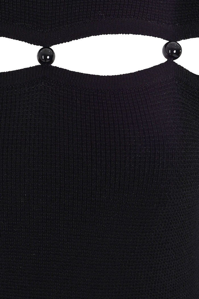 Black ribbed maxi dress with cut-out detail at neckline and black beaded button closures