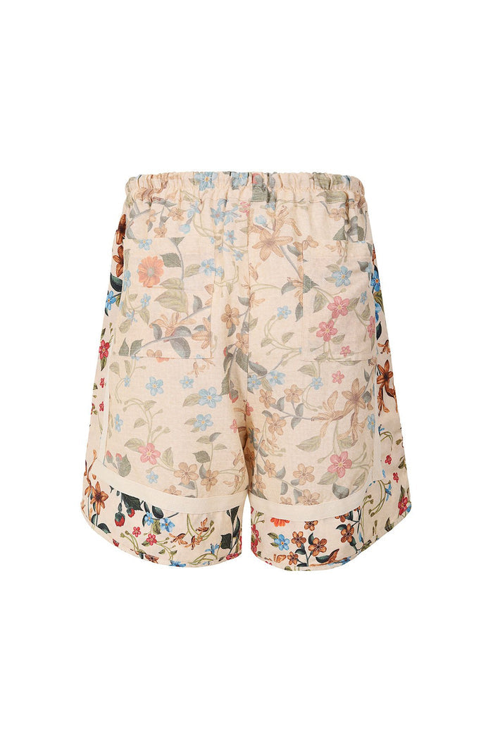 Georgie men's shorts in cream with all-over floral print featuring multicolored flowers and green leaves, elastic waistband with drawstring and side…