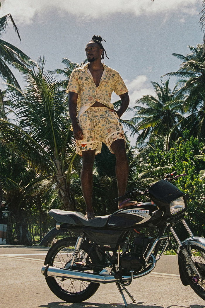 Georgie Men's Shorts in light yellow with all-over floral print, elastic waistband, and side pockets