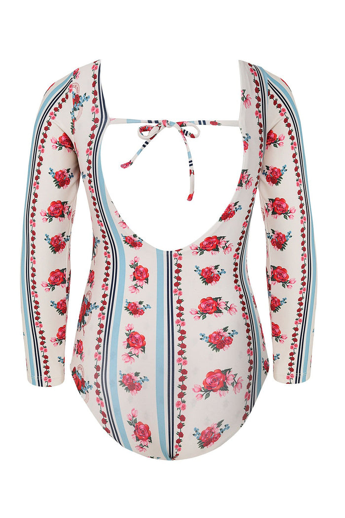 Long-sleeve kids' one piece swimsuit in cream with vertical blue stripes and red and pink rose pattern detail print, featuring open back with tie clo…