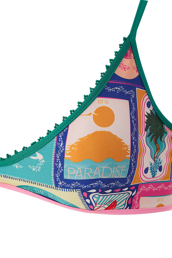 Triangle bikini top with green trim and pompom details, multicolored patchwork print featuring sunset graphics, botanical embroidery, and Paradise te…