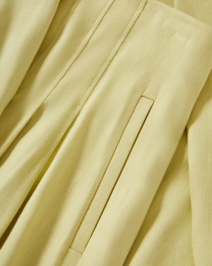 Veronica Beard Light green satin camisole with lace trim and matching wide-leg pleated trousers.