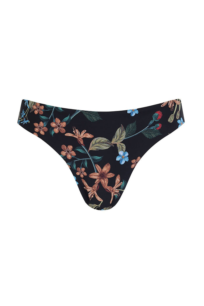 Ilu bikini bottom in black with botanical pattern detail print featuring coral, blue, and green blooms with leaves