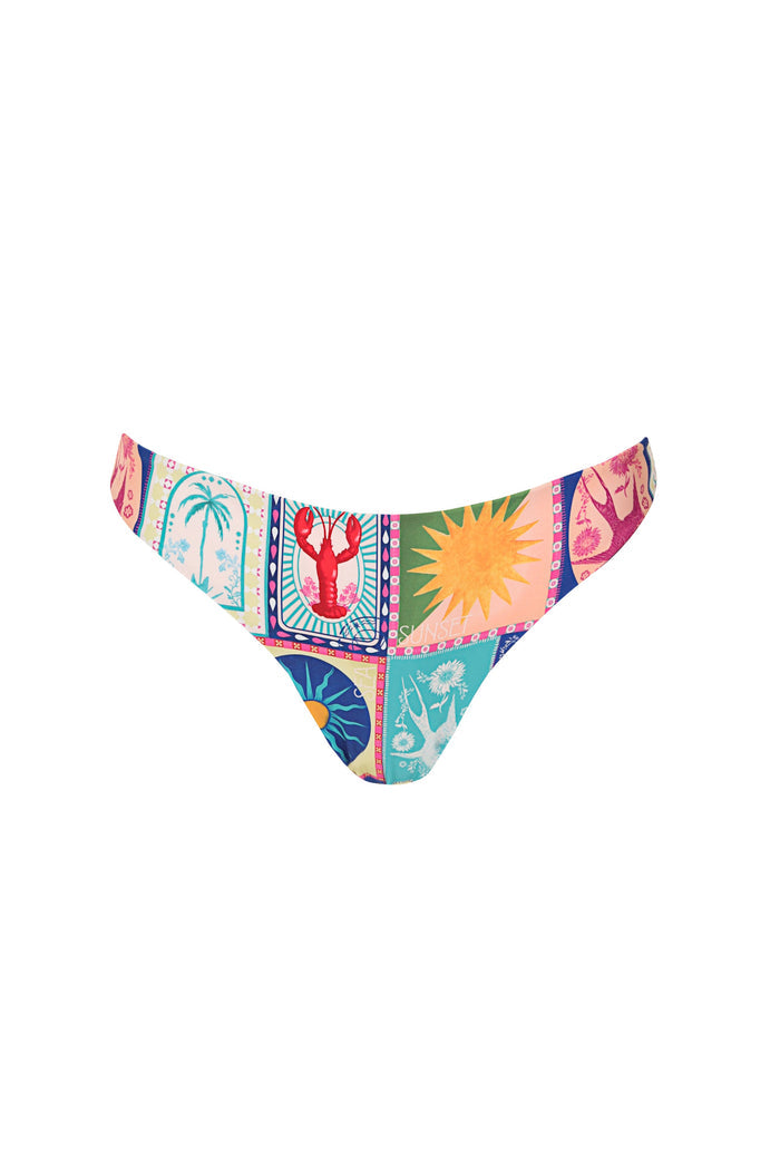 Ilu bikini bottom in multicolor patchwork print with framed panels featuring palm trees, sun rays, and tropical florals in turquoise, coral, yellow,…