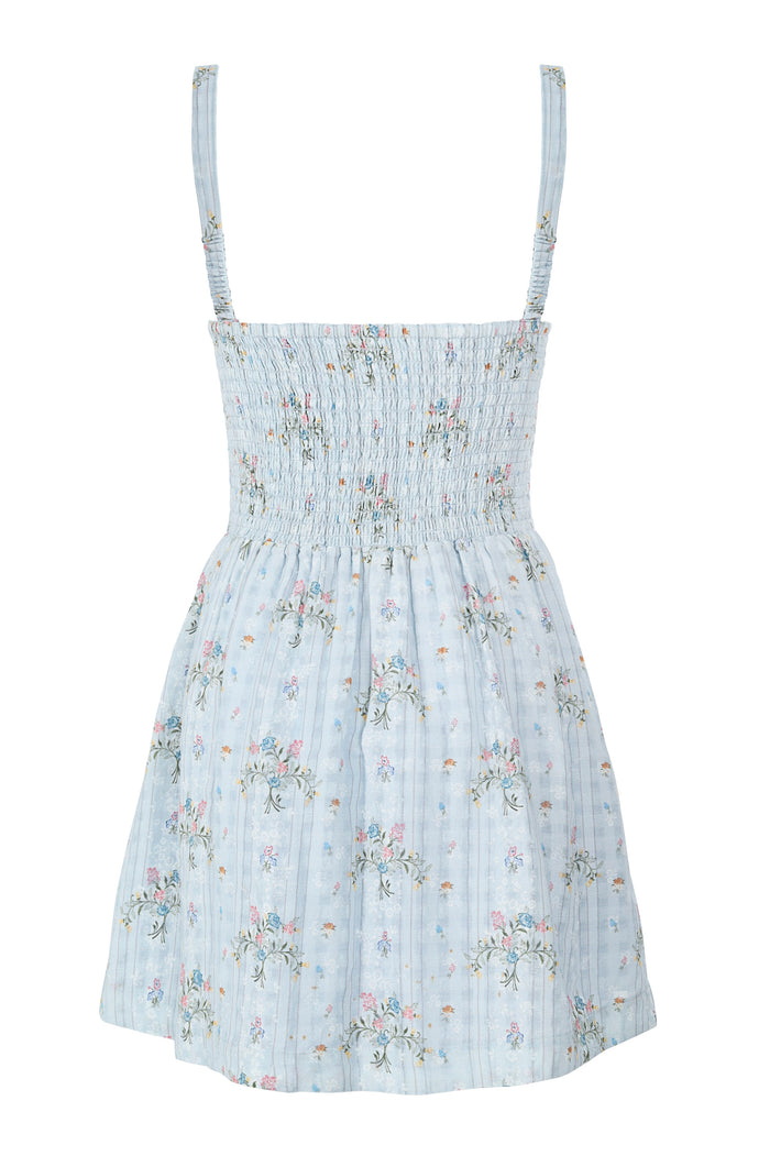 Light blue mini dress with adjustable straps, smocked bodice, and scattered pattern detail embroidery throughout