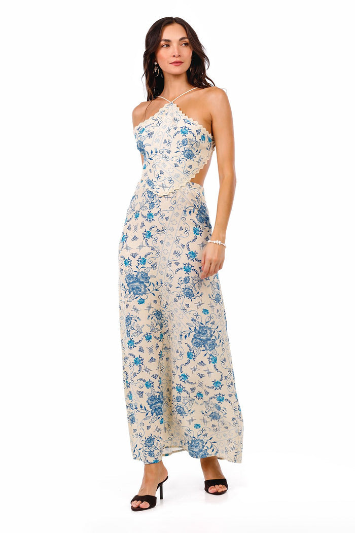 Indira halter maxi dress in cream with blue pattern detail print, open back with braided straps, and scalloped lace trim