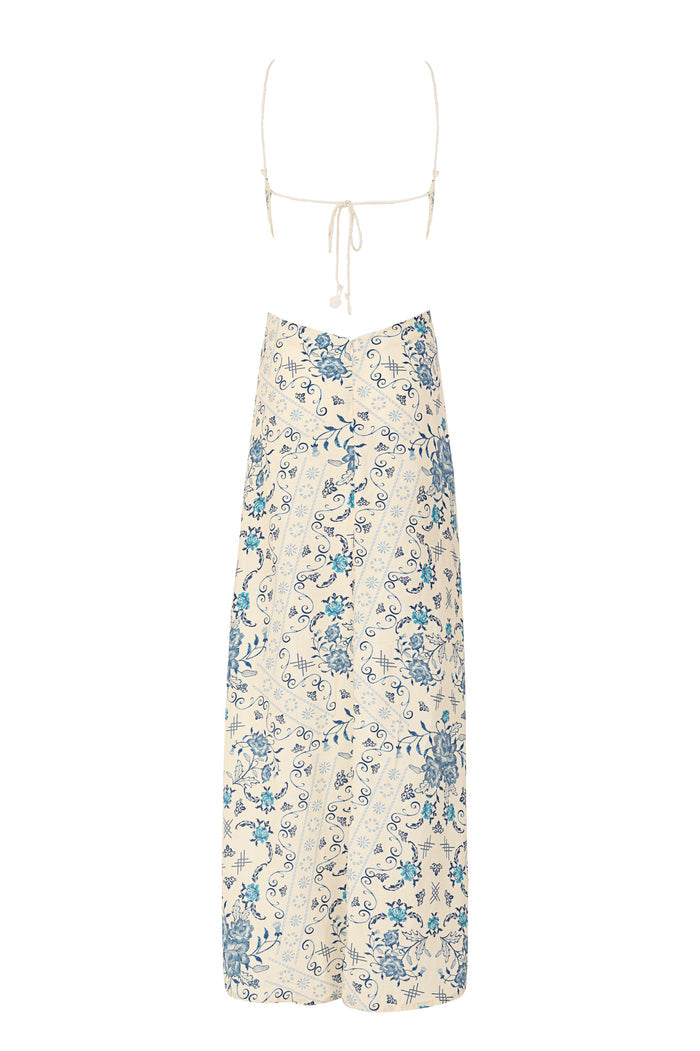 Indira halter maxi dress in cream with blue pattern detail print, scrollwork details, and scalloped lace trim at neckline