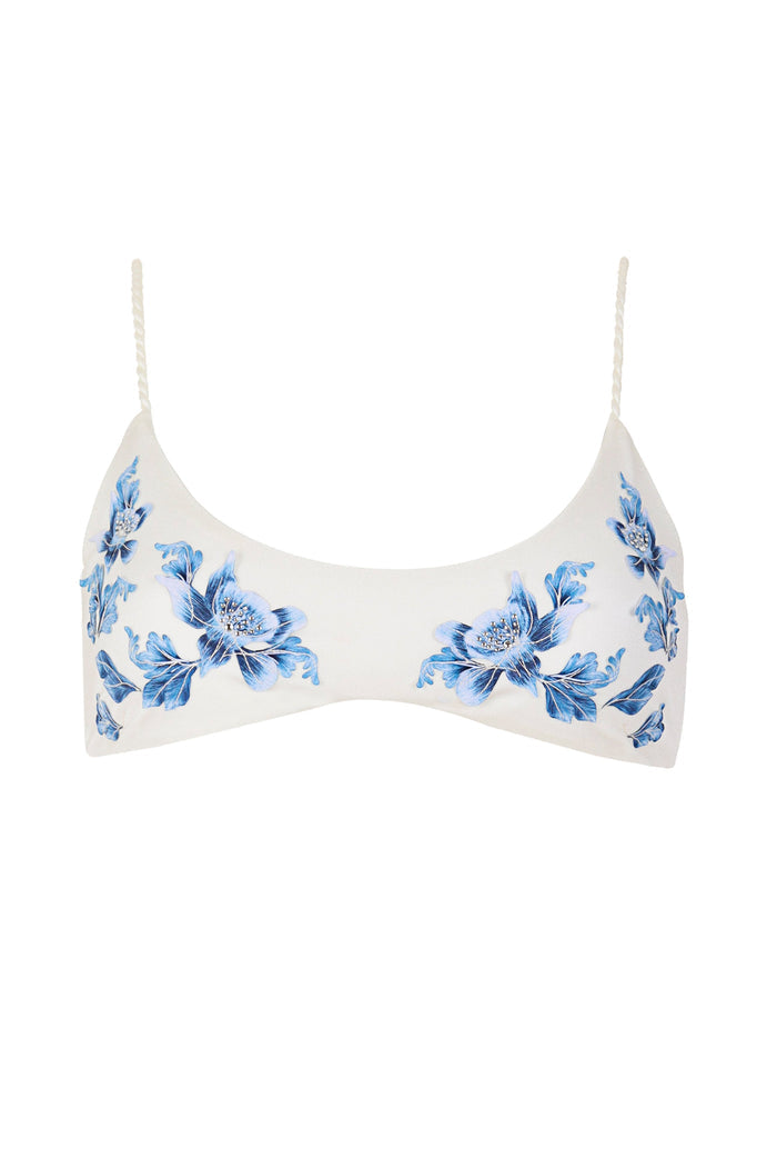 White bikini top with blue 3D floral appliqués and beaded embellishments on braided straps