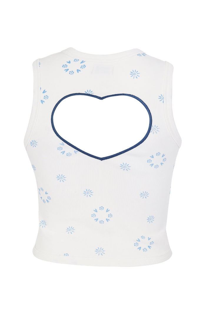 White ribbed sleeveless top with blue embroidered pattern detail and starburst details and heart-shaped cutout at back
