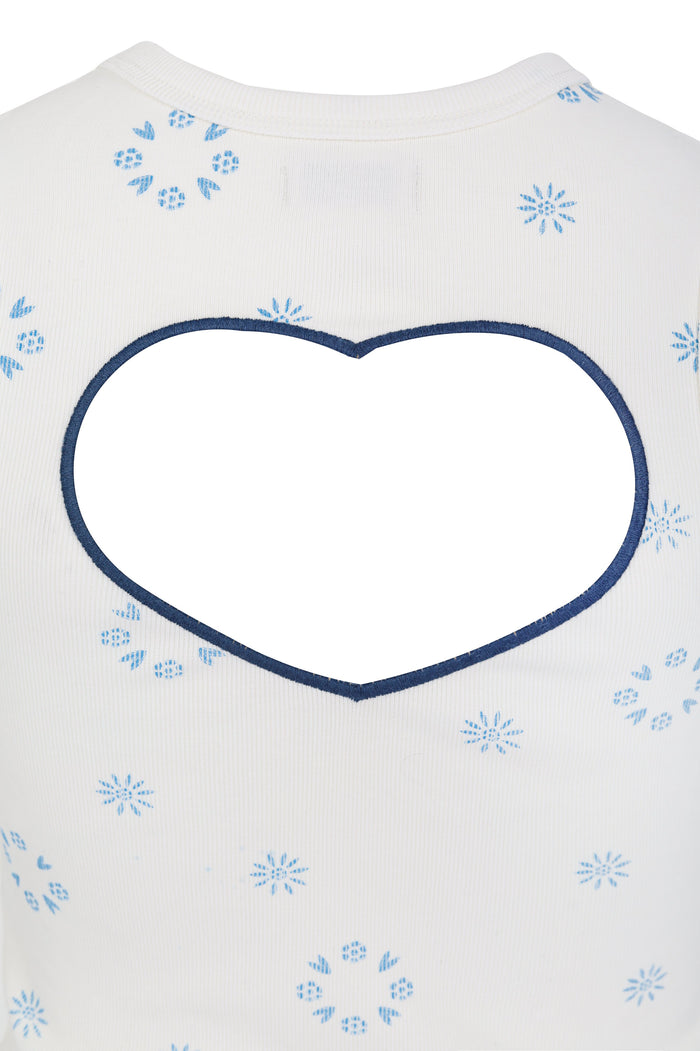 White ribbed sleeveless top with heart-shaped back cutout and blue embroidered pattern detail and starburst pattern