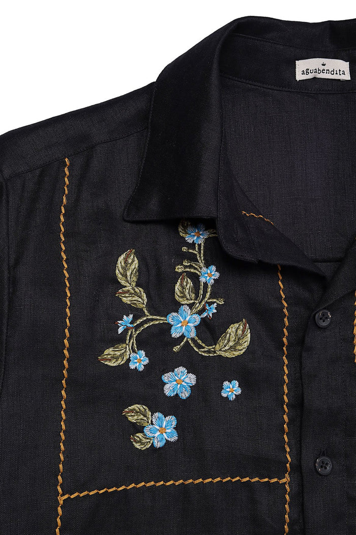 Black linen shirt with blue floral embroidery and golden topstitching detail on chest panel