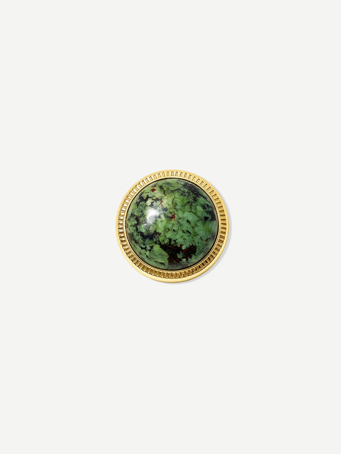 Veronica Beard Round gold-rimmed green gemstone ring with ribbed edge.