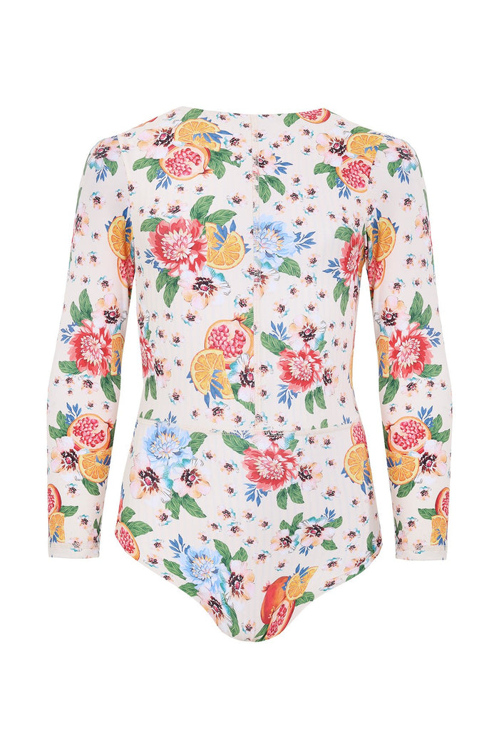White long-sleeve one-piece swimsuit with colorful print of citrus slices, pomegranates, dahlia flowers and green leaves