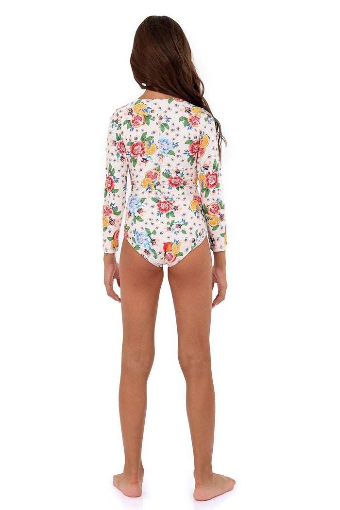 Back view of Jesse Kids one piece swimsuit in white with long sleeves, front zipper, and colorful pattern detail print featuring pink, yellow, blue,…